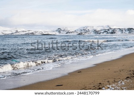 Scenic seascape of Barents Sea coastline in village Teriberka. Sunset arctic winter landscape in Murmansk region of Russia. High quality photo