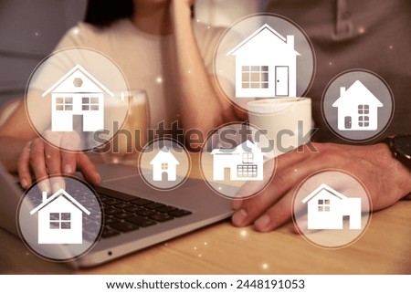 House search. Couple choosing home via laptop at table, closeup. Illustrations of different buildings as real estate variations