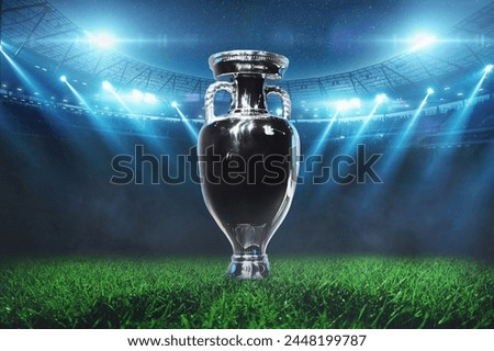 Football field with soccer cup with floodlights. Football championship final, creative idea. Tournament and World Championship. Euro 2024 Royalty-Free Stock Photo #2448199787