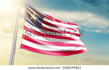 Liberia national flag waving in beautiful sky.