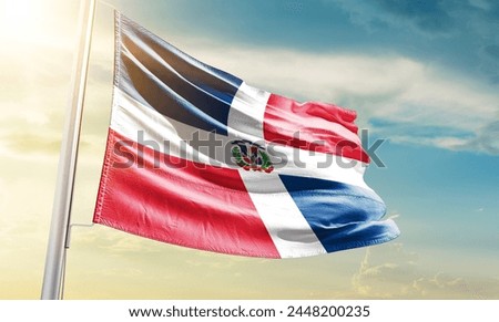 Dominican Republic national flag waving in beautiful sky.