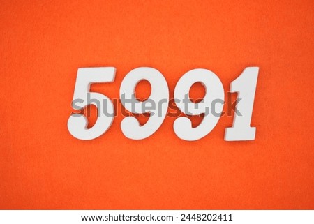 Orange felt is the background. The numbers 5991 are made from white painted wood.