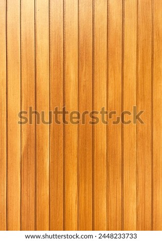 Clean light wooden plank wall, desk, floor, deck, or table surface area with natural warm toned sun light and empty copy space isolated on vertical ratio background. Royalty-Free Stock Photo #2448233733