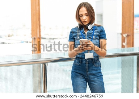 Young business woman checking the phone for her upcoming meetings