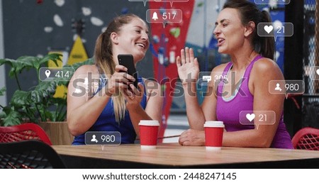 Image of social media data processing over caucasian women in sportswear using smartphone. Global sports, science, digital interface and data processing concept digitally generated image.