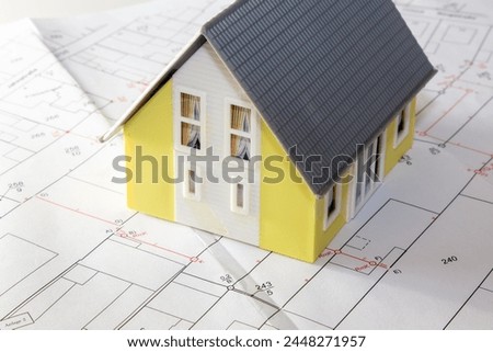 Symbol image building: Model house on a development plan