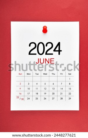 June 2024 calendar page with push pin on red background.