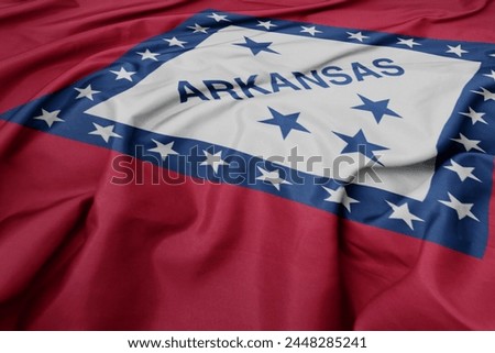 waving colorful flag of arkansas state. macro shot