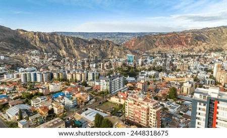 La Paz, Bolivia, aerial view flying over the dense, urban cityscape. San Miguel, southern distric. South America Royalty-Free Stock Photo #2448318675