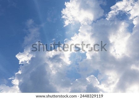 Huge clouds like cotton wool in the sky. Large white clouds against a blue sky.  Royalty-Free Stock Photo #2448329119