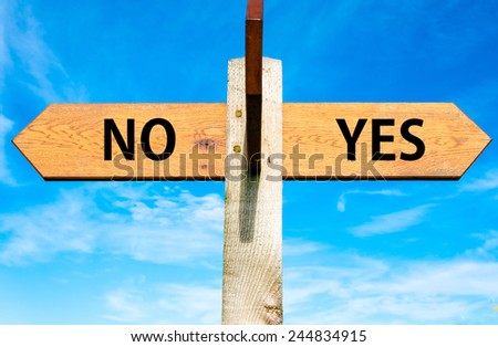 Wooden signpost with two opposite arrows over clear blue sky, YES and No messages, Decisional conceptual image