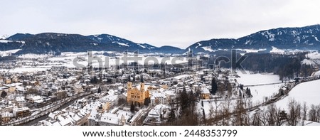 Wide panoramic aerial view of Brunico (Bruneck), South Tyrol, Italy in the winter.