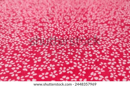 Floral fabric background in white and pink colors.