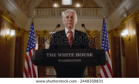 Senior republican politician answers press questions and gives interview for TV breaking news in White House. Confident political speech during press conference. Campaign speech. Political discourse. Royalty-Free Stock Photo #2448358831