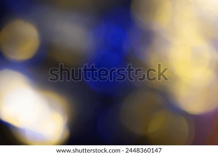 Defocused neon light. Overlaying highlights. Futuristic LED lighting. Neon colors blur on dark abstract background