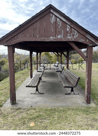 A line of benches under an overhang in Marblehead, MA.