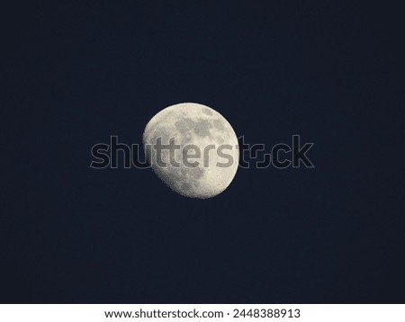 Moon in a dark sky, fourth phase, waxing gibbous, over Galloway, New Jersey. 
