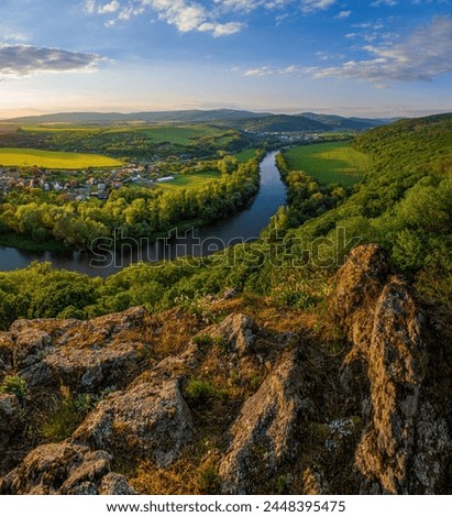 Spring sunset over meander of river Hron in Slovakia from extinct volcano, biotope of rare plants and flowers. Krivin, Hronsky Benadik. Discover the spring beauty of the mountains and rivers. Royalty-Free Stock Photo #2448395475