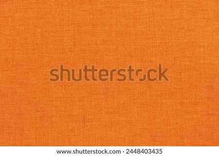 Orange fabric cloth texture for background, natural textile pattern.