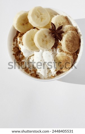 Breakfast Bowl of Greek Yogurt, Cottage Cheese, with Freshly Baked Granola, Nuts, Banana Slices. Dairy Products Breakfast Food.