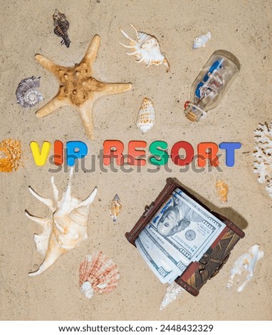Money for vacation, rest, holiday, dream, travel. A well-deserved vacation at an expensive seaside resort. Chest with dollars on the beach. The inscription in on the sand "Vip Resort" Royalty-Free Stock Photo #2448432329