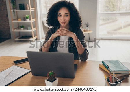 Photo of thoughtful positive clerk dressed shirt chatting apple samsung device indoors workshop workplace workstation