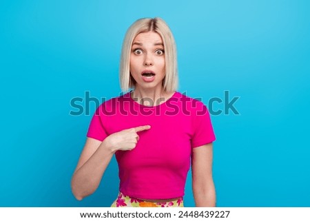 Photo portrait of lovely young lady point self shocked frightened dressed stylish pink clothes isolated on blue color background