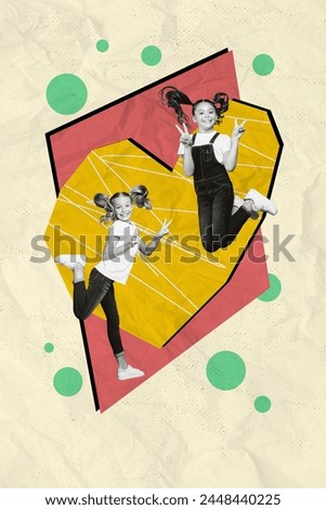 Vertical collage image of two black white gamma girls jumping demonstrate v-sign big painted heart isolated on paper background