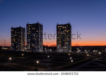 multi-storey buildings against the background of the sunset sky
