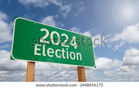 2024 Election Just Ahead Green Road Sign Over Clouds and Blue Sky.