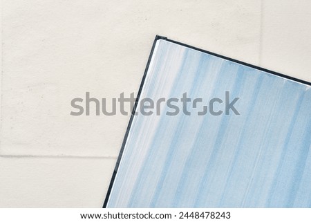 patterned blue gradient fluid lines on paper with texture (featuring corner element) Royalty-Free Stock Photo #2448478243