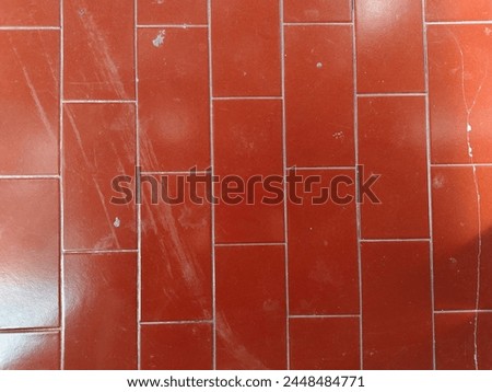 A textured red checkered background.