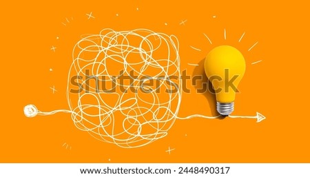Clarifying complex ideas theme with light bulb - Flat lay Royalty-Free Stock Photo #2448490317