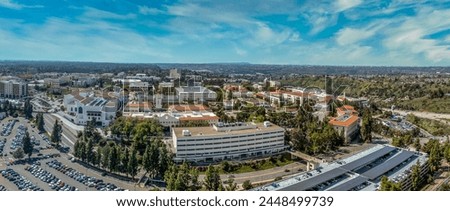 Aerial panorama view of San Diego State University, accredited public higher education institution with centennial plaza, aztec student union, health and human sciences college, love library,  Royalty-Free Stock Photo #2448499739