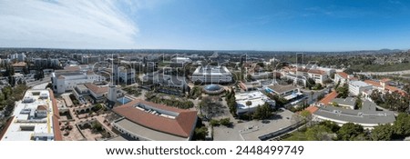 Aerial panorama view of San Diego State University, accredited public higher education institution with centennial plaza, aztec student union, health and human sciences college, love library,  Royalty-Free Stock Photo #2448499749