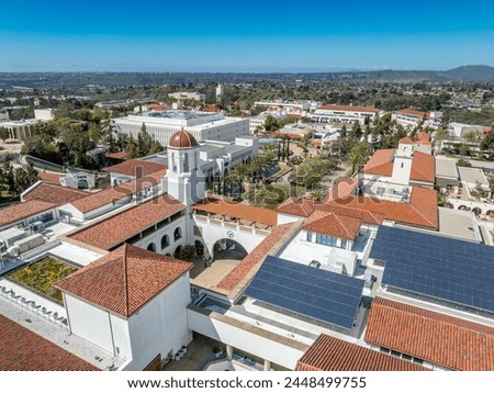 Aerial panorama view of San Diego State University, accredited public higher education institution with centennial plaza, aztec student union, health and human sciences college, love library,  Royalty-Free Stock Photo #2448499755