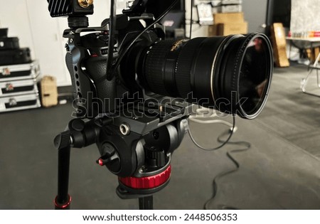 DSLR camera technology with lens and tripod mount in the photo industry