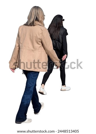 Two women walking behind each other in perspective. Cut out people on white background for renders and 3d visualization. Stylish cutout pedestrian woman for architectural 3d visualization and render