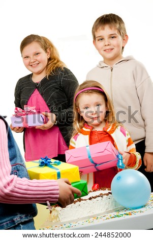 Group of adorable kids having fun at birthday party 