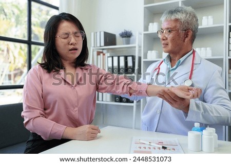 An elderly doctor with a stethoscope uses his hand to hold the patient's wrist to listen to the patient's pulse. Before planning treatment, medicines, service concepts health care health insurance.