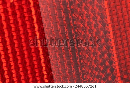 Safety reflector texture background. Light red reflector pattern