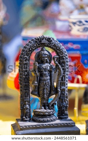 A handmade wooden idol of Lord Ram sounds like a beautiful tribute to the deity's revered presence in Hindu mythology and culture.  Royalty-Free Stock Photo #2448561071