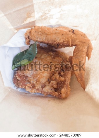 Fried chicken wings with herb Thai street food, stock photo