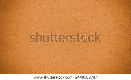 Brownish corrugated cardboard texture background. Brownish paper cardboard with a soft color. Brownish corrugated cardboard texture is useful as a background. Paper background texture. Royalty-Free Stock Photo #2448583747