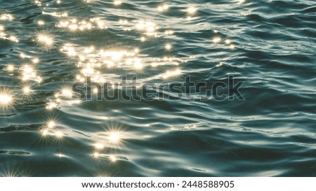 "Dive into the mesmerizing beauty of the sea with this breathtaking image. 🌊✨ A tranquil expanse of ocean, adorned with gentle waves that kiss the shore, glistens under the golden rays of the sun. Lo