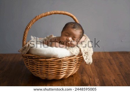 Cute Asian baby boy poses in a photo shoot room in Jakarta, Indonesia