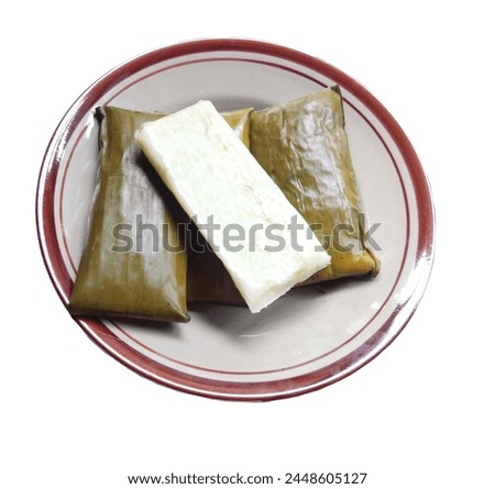 Buras is a traditional Indonesian food usually served as a special dish to celebrate Eid al-Fitr or Eid al-Adha. Buras is made from glutinous rice wrapped in banana leaves or coconut leaves, then st Royalty-Free Stock Photo #2448605127