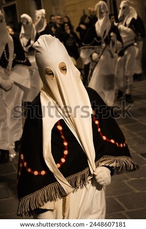 Hooded penitents during the famous Good Friday procession in Chieti (Italy) with their hoods pulled Royalty-Free Stock Photo #2448607181