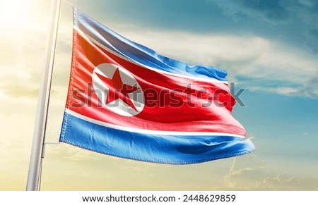 North Korea national flag waving in beautiful sky.