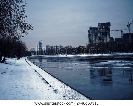 Embankment of the Moscow river in early spring, cloudy morning